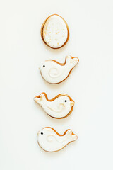 Easter gingerbread in the shape of a bird and a rabbit on a white background. High quality photo. space for text. banner
