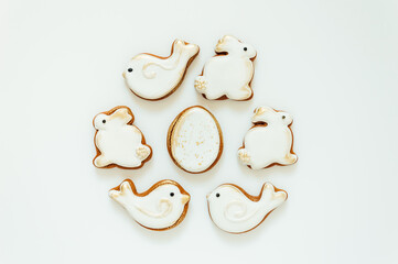 Easter gingerbread in the shape of a bird and a rabbit on a white background. High quality photo. space for text. banner