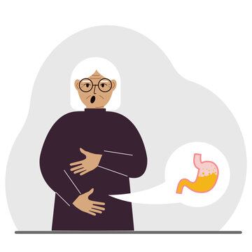 The concept of pain in the abdomen. The old woman holds his stomach with both hands. Problems with the stomach or digestion.