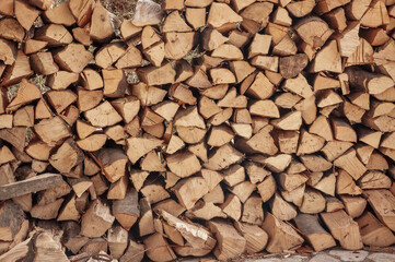 Beautifully stacked firewood. Natural wood for the furnace. Natural texture.