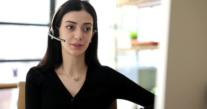 Woman in headphones with microphone talking to client 4k movie