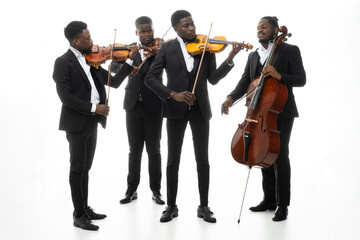 Studio portrait of a string quartet on a white background. African americans