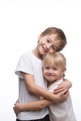 Portrait of a child, the love of brother and sister in his arms on a white background