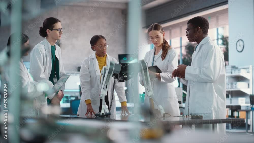 Poster Diverse Team of Industrial Robotics Specialists Discussing Mobile Robot, Brainstorming Prototype Improvement Ideas. Engineers In Lab Coats Discussing Automated AI Robotic Dog, Using Laptop and Tablet