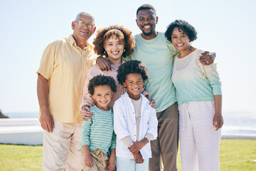 Love, smile and portrait of a happy family at a beach for travel, vacation and holiday on nature background. Relax, face and trip with children, parents and grandparents bond while traveling in Miami