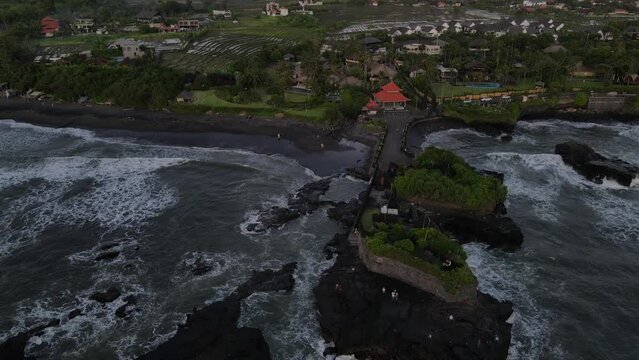 Black sand beach temple drone