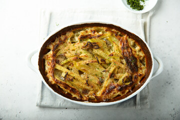 Traditional homemade potato gratin with herbs