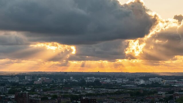 Sun peaking through clouds in surrounding of Rotterdam time lapse