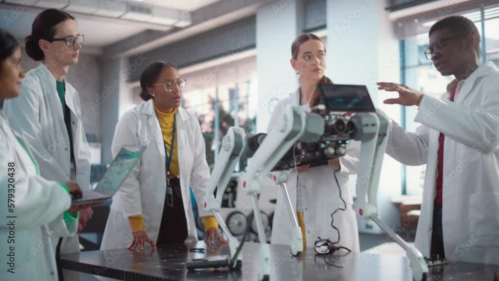 Poster Diverse Team of Industrial Robotics Specialists Gathered Around a Table With a Mobile Robot. Engineers In Lab Coats Discussing an Automated AI Robotic Dog, Using Laptop Computer, Brainstorming