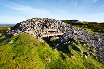 Carrowkeel Neolithic passage tomb necropolis. Bricklieve Hills, Co. Sligo, Ireland. Cairn G showing light box and entrance. Cairns H and K in distance