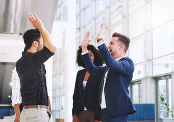 Success, office and excited business people high five after good business deal, meeting and partnership. Teamwork, collaboration and diversity in corporate workplace with happy workers in celebration