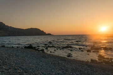 Sunset over Sfinari Beach in Crete, Greece