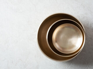 Various bowls made of brass, background