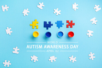 World Autism Awareness Day Card, colorful Puzzles on Blue Background.