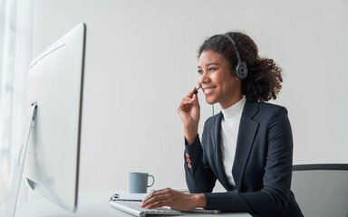 close up call center operator in wireless headset talking with customer, woman in headphones with...