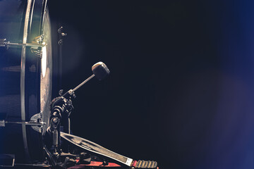 Obraz na płótnie Canvas Bass drum with pedal, musical instrument on black background.