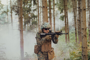 A modern warfare soldier on war duty in dense and dangerous forest areas. Dangerous military rescue...