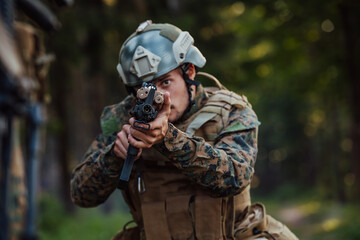 A modern warfare soldier on war duty in dense and dangerous forest areas. Dangerous military rescue...