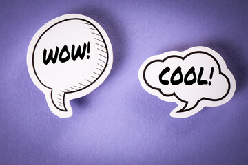 WOW and COOL text on speech bubbles. Purple background