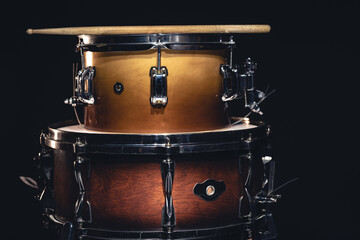 Fototapeta na wymiar Drums on a dark background isolated, percussion instruments.
