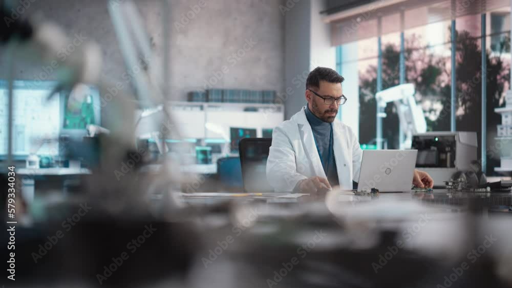 Aufkleber portrait of a professional male scientist working in an industrial lab using laptop computer. succes