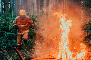 firefighter hero in action danger jumping over fire flame to rescue and save