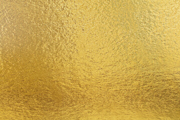 Texture of gold. Golden iridescent festive and expensive background.