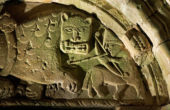 Rock of Cashel. Tympanum above north door of Cormac's Chapel, Norman centaur kills Celtic Christian lion. Co. Tipperary, Ireland