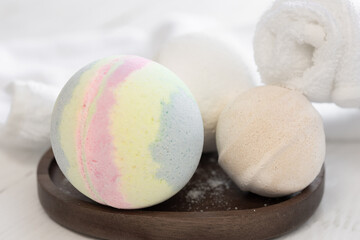 Spa composition with bath bombs and towels, close-up.