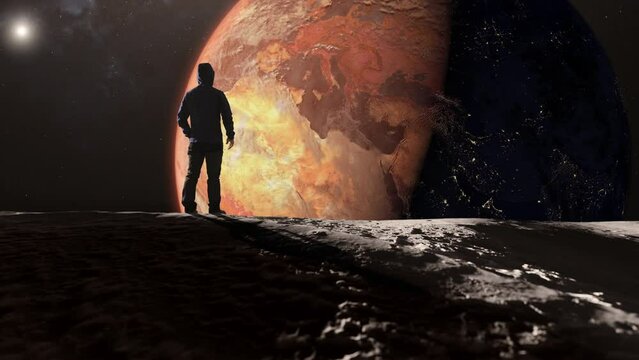 Global warming,man standing on the surface of the moon looking at dry arid earth,person looking at the earth from the space,climate change concept