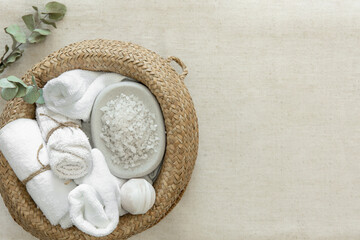 Spa composition with towels, sea salt and bath bombs, top view.
