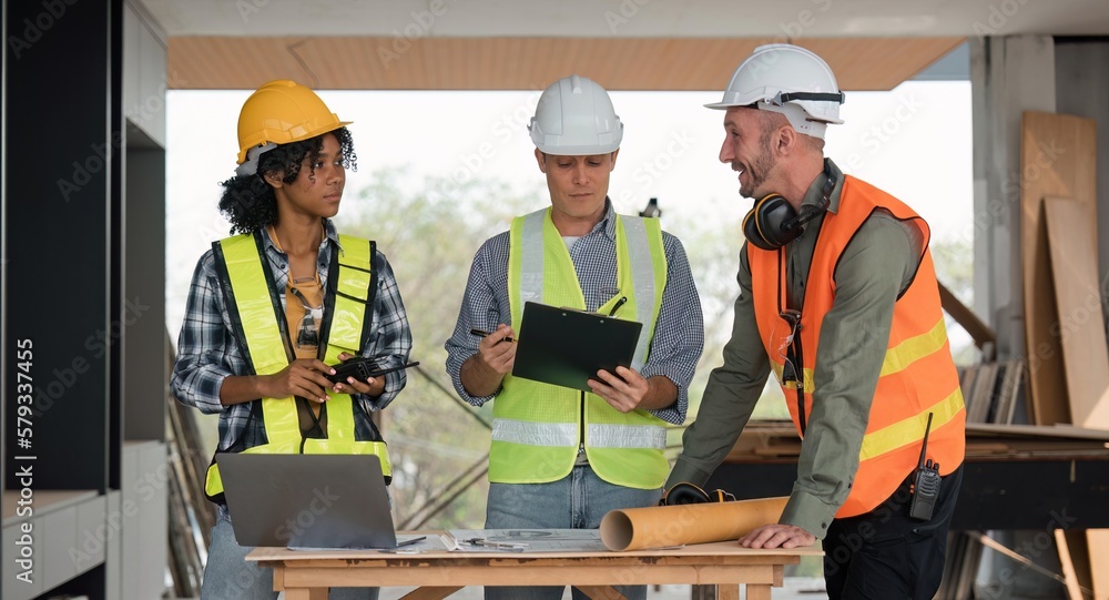 Aufkleber engineer team planning and discussing about construction building on table in working site