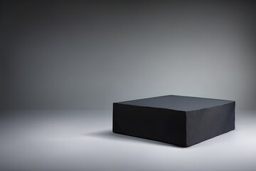 Black slate plinth against a grey background in a studio setting with soft light. Generative AI.