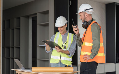 Engineer team discussing meeting on plan at construction site