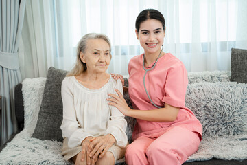 Friendly nurse supporting senior lady at nursing home,Senior services and geriatric care concept.