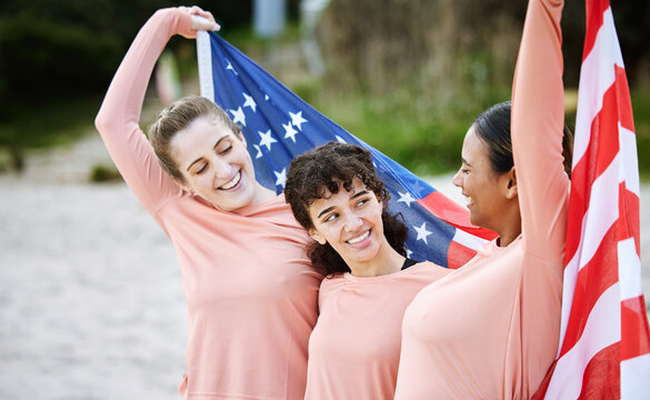 Volleyball woman, team and american flag at beach, happiness and pride for celebration, winning or goal. Women, sports and diversity with support, solidarity or teamwork for winner with excited smile