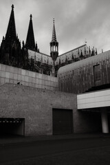 Cubist architecture of the Roman-Germanic Museum in front of Cologne Cathedral in Cologne, Germany