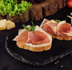bruschetta set with parma ham and parmesan cheese