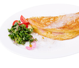 Omelette with ham cherry tomatoes on plate