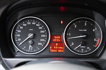 Speedometer unit of a car in closeup - obrazy, fototapety, plakaty