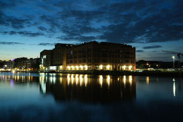 Naklejka premium Old brick building illuminated at sunset in the harbor of Munster, Germany
