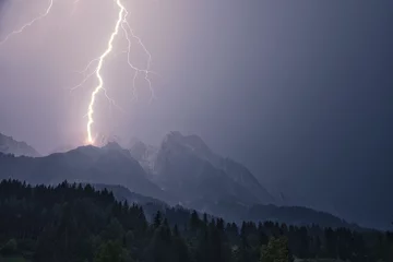 Poster Dramatic lightning strike during a thunderstorm in the Steinberg in Leogang, Salzburg, Austria © codebude