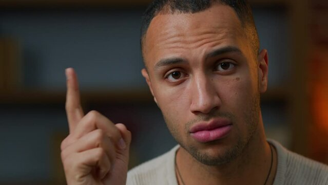 Portrait of African american latino male homeowner 30s man looking at camera shaking index finger warn gesture serious guy warning caution distrust disagree with idea bad choice prohibit threat forbid