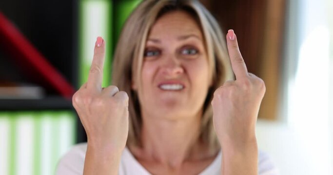 Angry aggressive woman showing middle finger