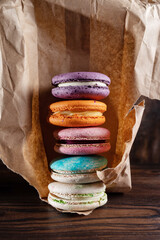 Macaroon cookies in paper packaging. Makar in craft paper. French cookies.