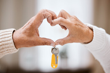 Senior couple, heart hands and keys for new home, success and bonding with love, care and support....