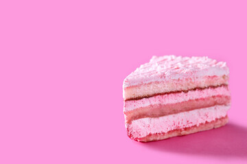 Pink strawberry cake portion on pink background. Copy space