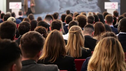 Crowd Of People Men And Women Attending Conference In Big Hall