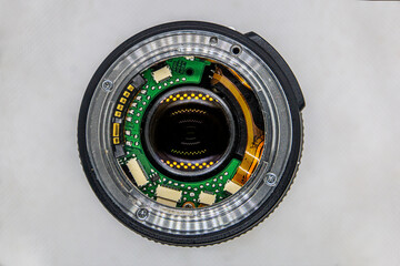 Chips and microcircuits in a camera lens on a white background	
