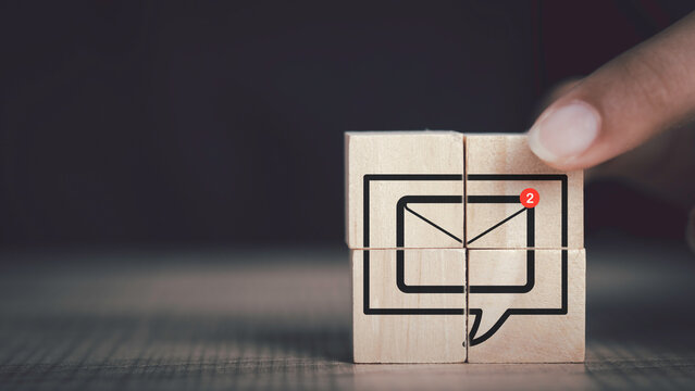 New email notification concept. In box alert and notification icon on wood cubes stack with copy space, Business e-mail communication and digital marketing. Newsletter, online working.